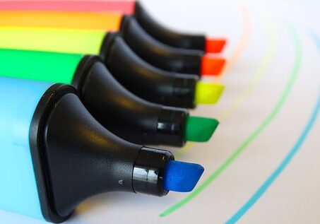 A row of markers with different colors on them.